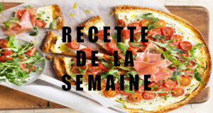 Pizza fine au fromage frais, tomates cerise, roquette et jambon cru.